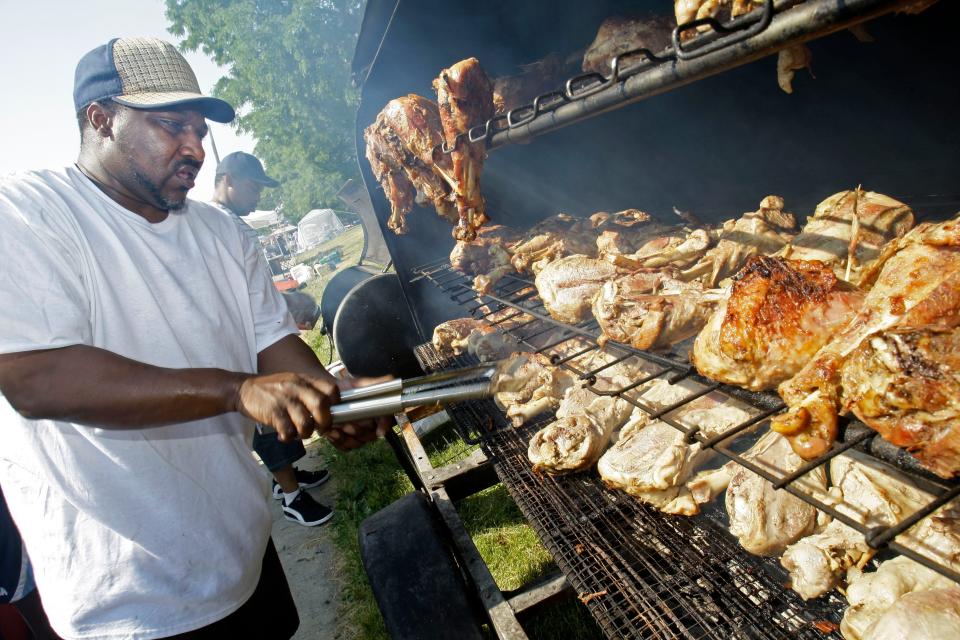 Some parts of the country – just like some parts of Florida – have hosted Juneteenth events longer than others. In this 2012 photo, Charles Howard braves the heat to grill turkey legs during a celebration in Milwaukee.