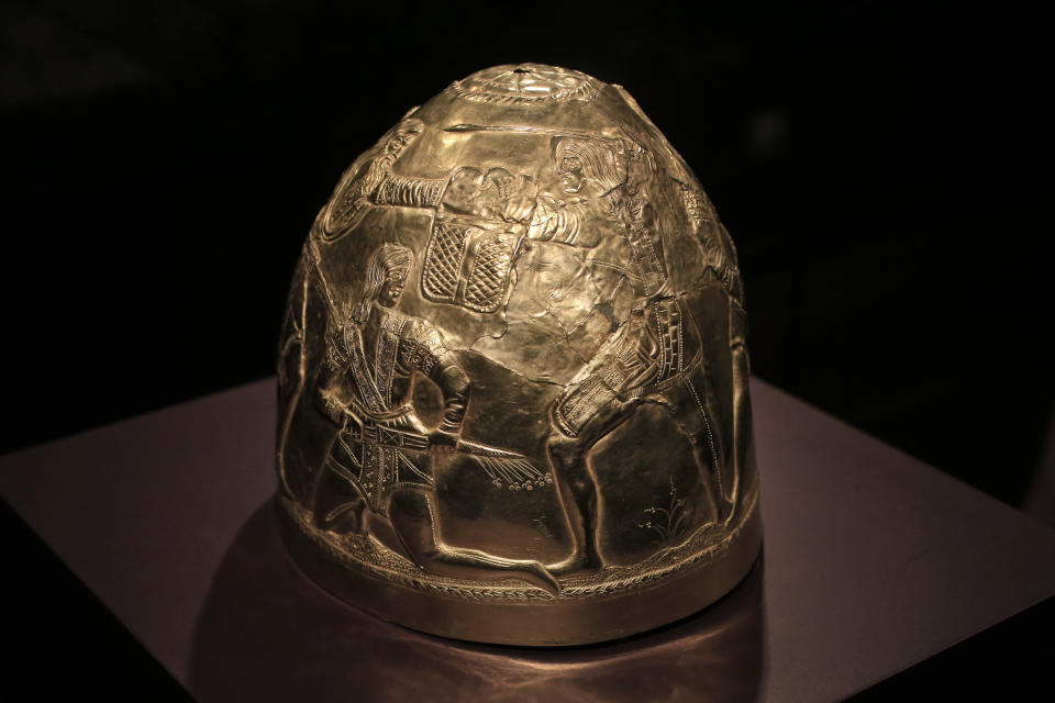 FILE - A Scythian gold helmet from the fourth century B.C. is displayed as part of the exhibit called The Crimea - Gold and Secrets of the Black Sea, at Allard Pierson historical museum in Amsterdam on April 4, 2014. A valuable collection of historical treasures from Crimea that were stored for years at an Amsterdam museum amid an ownership dispute sparked by Russia's annexation of the peninsula has been safely transported to war-torn Ukraine, the museum announced Monday, Nov. 27, 2023. (AP Photo/Peter Dejong, File)
