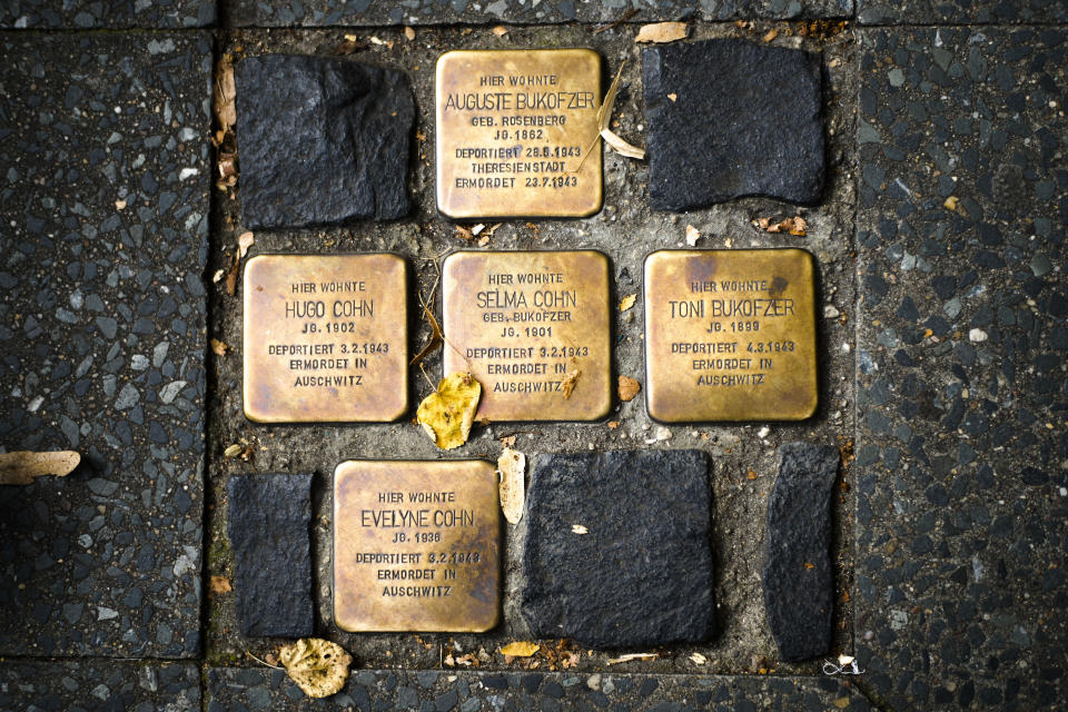 So called stumbling blocks, marking the last voluntarily chosen places of residence of the victims of the Nazis, are embedded in the pavement in Berlin, Germany, Wednesday, Sept. 9, 2020. The Department for Research and Information on Anti-Semitism Berlin, or RIAS documented 410 incidents in Berlin, more than two a day, in the first half of 2020, including physical attacks, property damage, threats, harmful behavior and anti-Semitic propaganda. (AP Photo/Markus Schreiber)