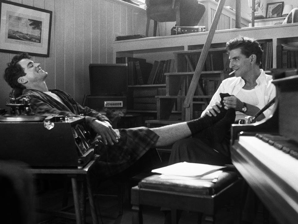 Leonard Bernstein (Bradley Cooper, right) fosters a close bond with clarinet player David Oppenheim (Matt Bomer) in "Maestro."