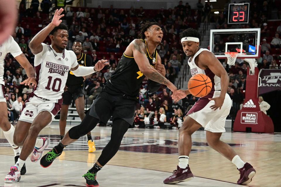 Missouri Tigers guard DeAndre Gholston (4) loses control of the ball to Mississippi State Bulldogs guard Eric Reed Jr. (11) during the first half  at Humphrey Coliseum.