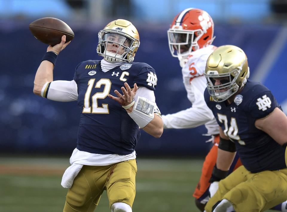 FILE - In this Saturday, Dec. 19, 2020, file photo, Notre Dame quarterback Ian Book throws a pass against Clemson during the Atlantic Coast Conference championship NCAA college football game in Charlotte, N.C. (Jeff Siner/The News & Observer via AP, File)