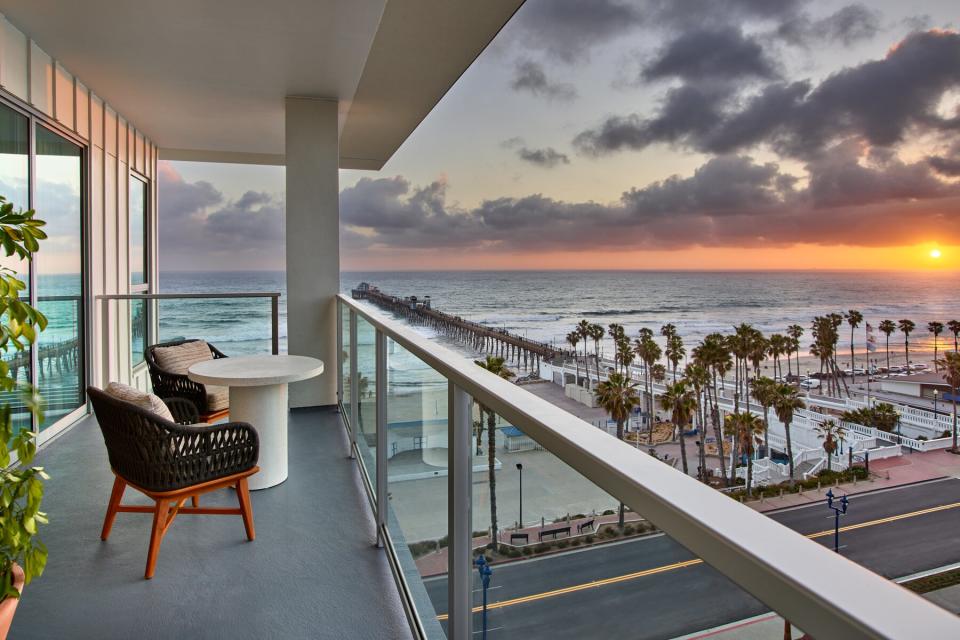 Balcony view of pier at ocean from Mission Pacific Hotel in Oceanside, California