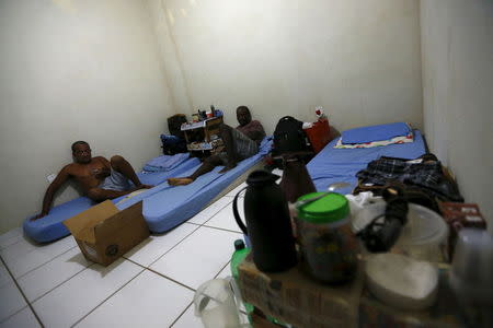 Laid-off workers of Comperj are pictured at a room of the Pousada do Trabalhador (Workers Inn), which closed down after the scandal involving Petrobras, on its last day of operations, in Itaborai March 31, 2015. REUTERS/Ricardo Moraes