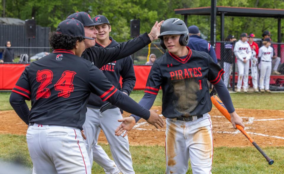 Cinnaminson Timothy Morrell is greeted at the dugout after scoring a run during a 3-1 win over Cherry Hill East in the opening round of the 49th annual Joe Hartmann Diamond Classic on Wednesday.