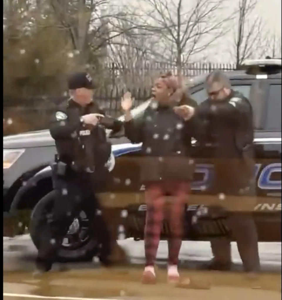 CORRECTS THE SPELLING TO LATICKA HANCOCK FROM LATINKA This A screen grab from video showing Butler Township officers Sgt. Tim Zellers, left, and Todd Stanley, right, restrain and arrest Laticka Hancock outside a McDonald's restaurant in Butler Township, Ohio, on Monday, Jan. 16, 2023. The officers said Hancock resisted arrest, and video shows Stanley strike Hancock. (Mario Robinson/ LOCAL NEWS X /TMX via AP)