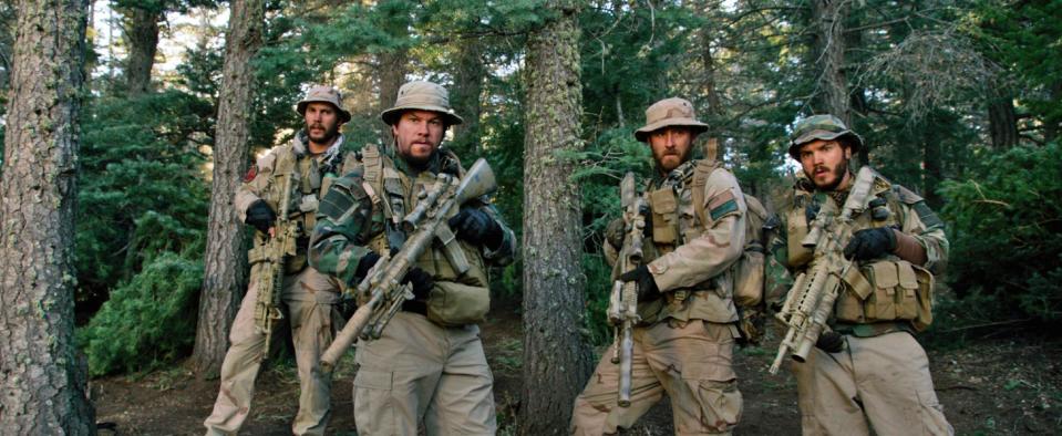 This photo released by Universal Pictures shows, from left, Taylor Kitsch, as Michael Murphy, Mark Wahlberg as Marcus Luttrell, Ben Foster as Matt “Axe” Axelson, and Emile Hirsch as Danny Dietz in a scene from the film, “Lone Survivor." "Frozen's" grip on the domestic box office is heading for a meltdown as the combat docudrama "Lone Survivor" threatens a firefight for the top spot with an expected gross of $15 million. (AP Photo/Universal Pictures)