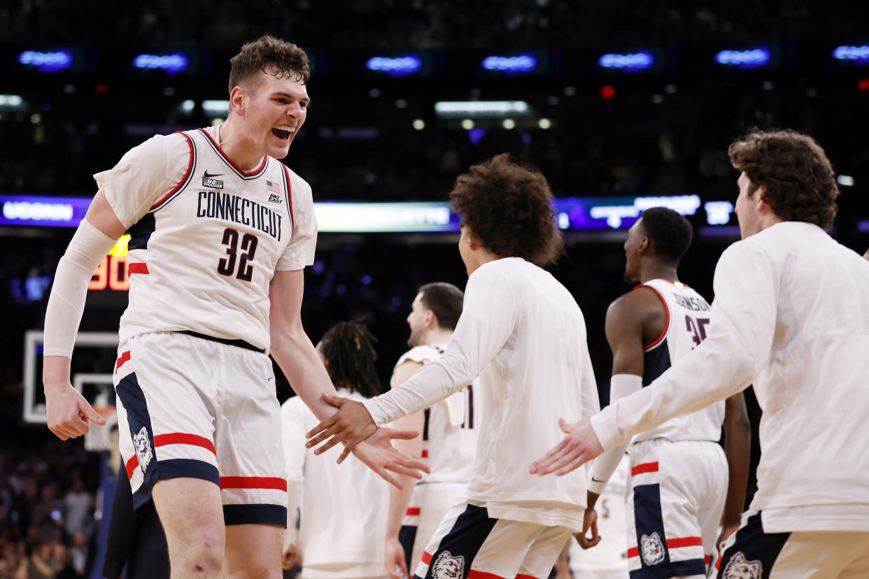 Donovan Clingan (32) of the Connecticut Huskies reacts during the team's win over Marquette in the Big East tournament final. (Photo by Sarah Stier/Getty Images)