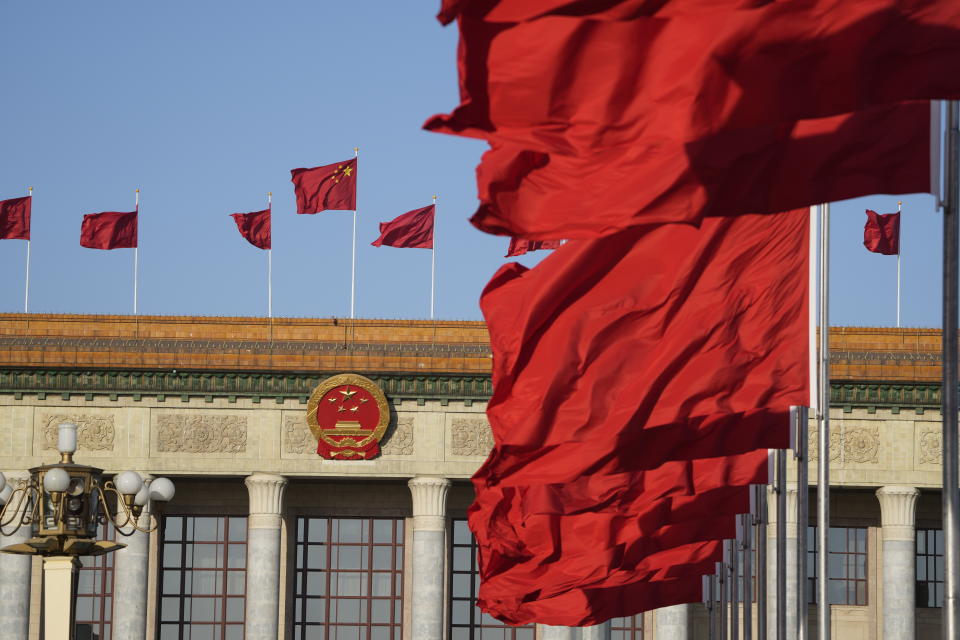 BEIJING, CHINA - MARCH 12: Chinese national flags flutter in front of the Great Hall during the fifth plenary meeting of the first session of the 14th National People's Congress (NPC) on March 12, 2023 in Beijing, China. (Photo by VCG/VCG via Getty Images)