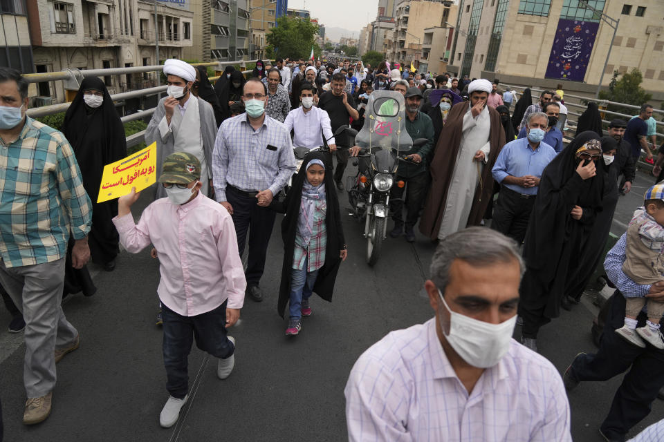 People attend the annual pro-Palestinian Al-Quds, or Jerusalem, Day rally in Tehran, Iran, Friday, April 29, 2022. Iran does not recognize Israel and supports Hamas and Hezbollah, militant groups that oppose it. (AP Photo/Vahid Salemi)