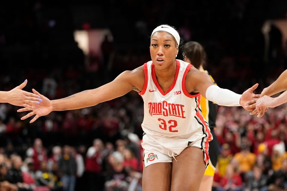 Jan 21, 2024; Columbus, Ohio, USA; Ohio State Buckeyes forward Cotie McMahon (32) gets high fives after making a free throw during the NCAA women’s basketball game against the Iowa Hawkeyes at Value City Arena. Ohio State won 100-92.