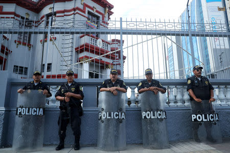 Police stand outside the Venezuelan embassy in Lima, Peru February 26, 2019. REUTERS/Guadalupe Pardo