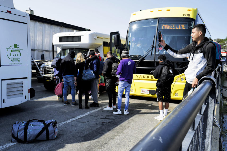 Venezuelan migrants gather at the Vineyard Haven ferry terminal in Martha's Vineyard, Mass. (Carlin Stiehl / Boston Globe via Getty Images file)