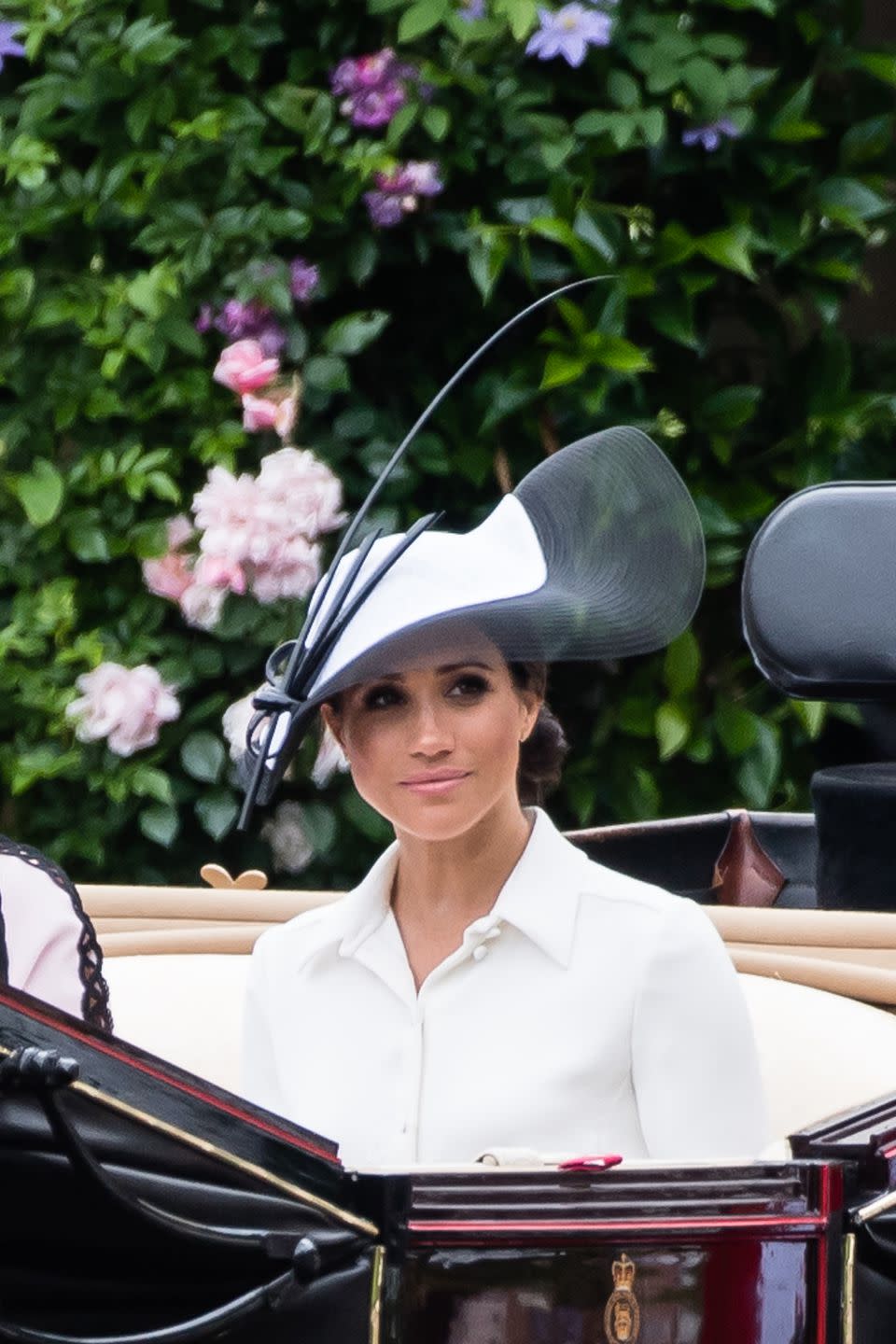 <p>Markle wore a Givenchy white dress and a Philip Treacy hat.</p>