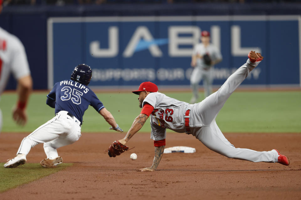 St. Louis Cardinals shortstop Edmundo Sosa falls after tagging out Tampa Bay Rays' Brett Phillips during the second inning of a baseball game Tuesday, June 7, 2022, in St. Petersburg, Fla. (AP Photo/Scott Audette)