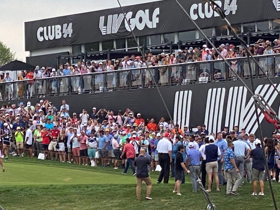 Former President Trump waits at the 18th green at LIV Bedminster.