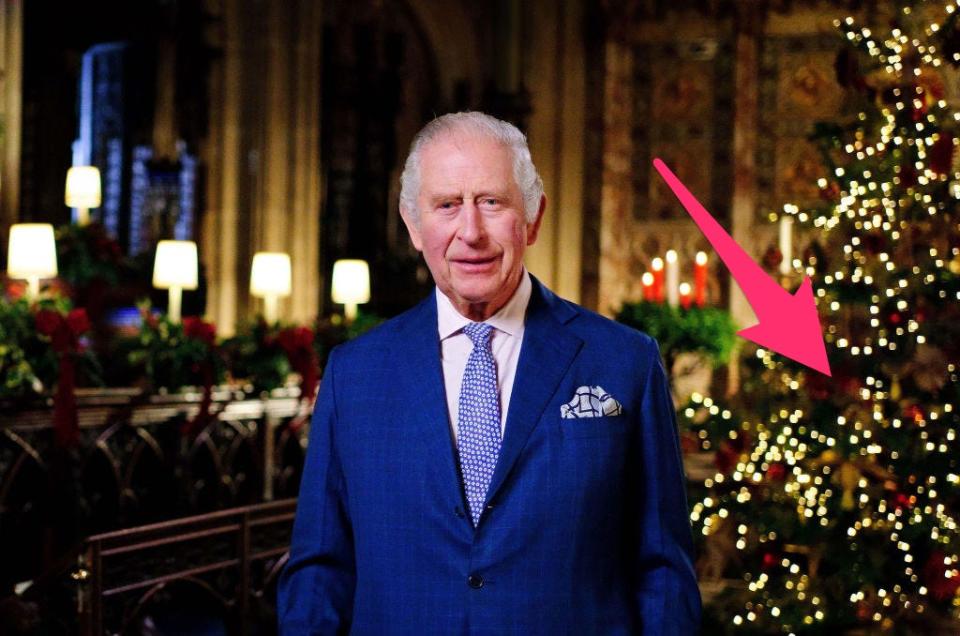 Prince Charles gives his Christmas speech. An arrow points to the Christmas tree in the background.