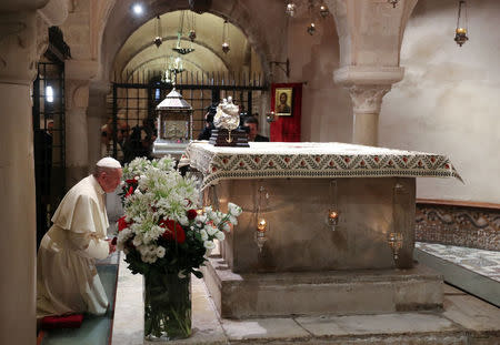 Pope Francis prays inside the cripta of the St. Nicholas Basilica in Bari, southern Italy July 7, 2018. REUTERS/Tony Gentile