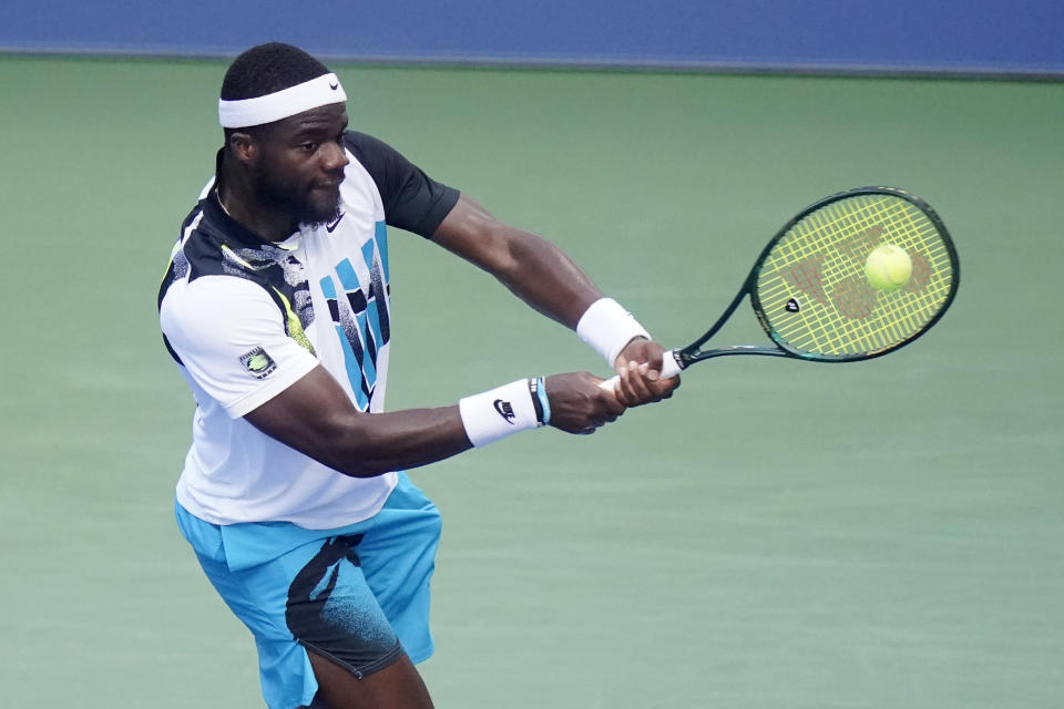 Frances Tiafoe, of the United States, returns a shot to Marton Fucsovics, of Hungary, during the third round of the US Open tennis championships, Saturday, Sept. 5, 2020, in New York. (AP Photo/Frank Franklin II)