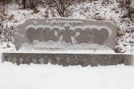 Snow flakes lie on The Rock of Angles memorial for the victims of the Sandy Hook Elementary School shooting in Newtown, Connecticut December 14, 2013 . Today marks the one year anniversary of the shooting rampage at Sandy Hook Elementary School, where 20 children and six adults were killed by gunman Adam Lanza. (REUTERS/Michelle McLoughlin)