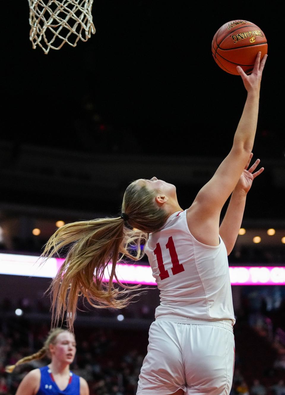 Ballard guard Raegan Loewe (11) goes up for a reverse layup during the class 4A quarterfinal of the Iowa high school girls state basketball tournament at Wells Fargo Arena on Tuesday.