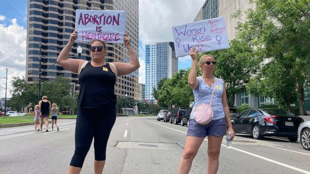 PHOTO: Protesters wave signs and demonstrate in support of abortion access in front of a New Orleans courthouse, July 8, 2022.  (Rebecca Santana/AP, FILE)