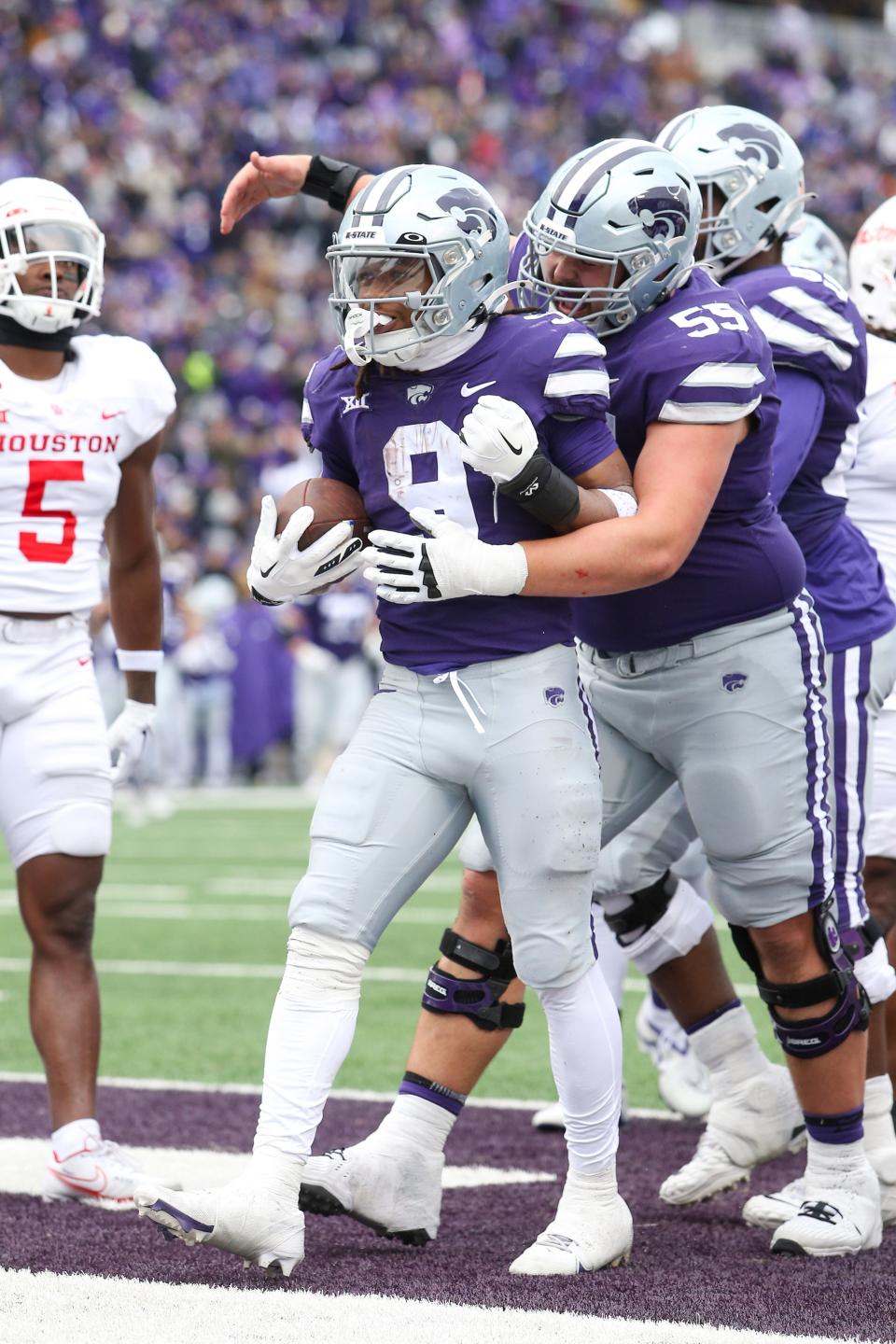 Oct 28, 2023; Manhattan, Kansas, USA; Kansas State Wildcats running back Treshaun Ward (9) is congratulated by offensive lineman Hayden Gillum (55) after scoring a touchdown against the Houston Cougars in the second quarter at Bill Snyder Family Football Stadium. Mandatory Credit: Scott Sewell-USA TODAY Sports