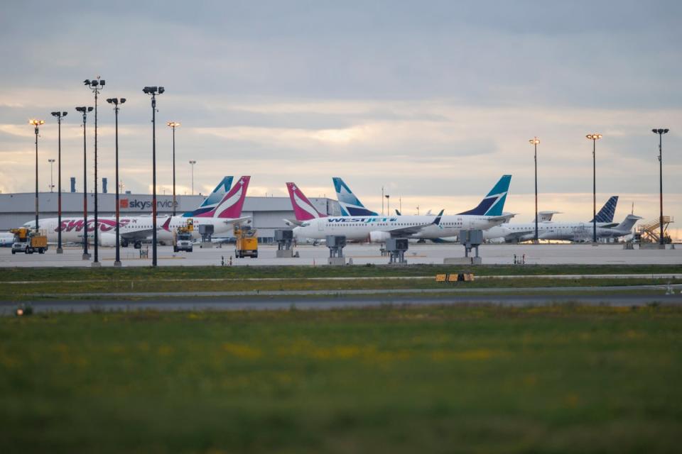 Westjet planes are seen parked at a Westjet hangar at Toronto Pearson International airport on Sunday. WestJet canceled 832 flights between last Thursday and Tuesday, over the country’s Canada Day holiday weekend. (Getty Images)