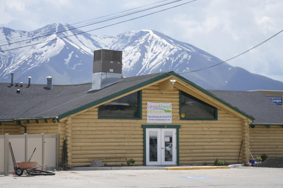 The Leap Ahead Daycare is shown Tuesday, May 23, 2023, in Spanish Fork, Utah. A 2-year-old boy was shot in the head by a stray bullet while playing outside the day care in Utah, the facility's owner and authorities said. Spanish Fork police believe the bullet came from a pellet or air gun shot from a farming field across the street west of the facility, Lt. Clay Slaymaker said. (AP Photo/Rick Bowmer)