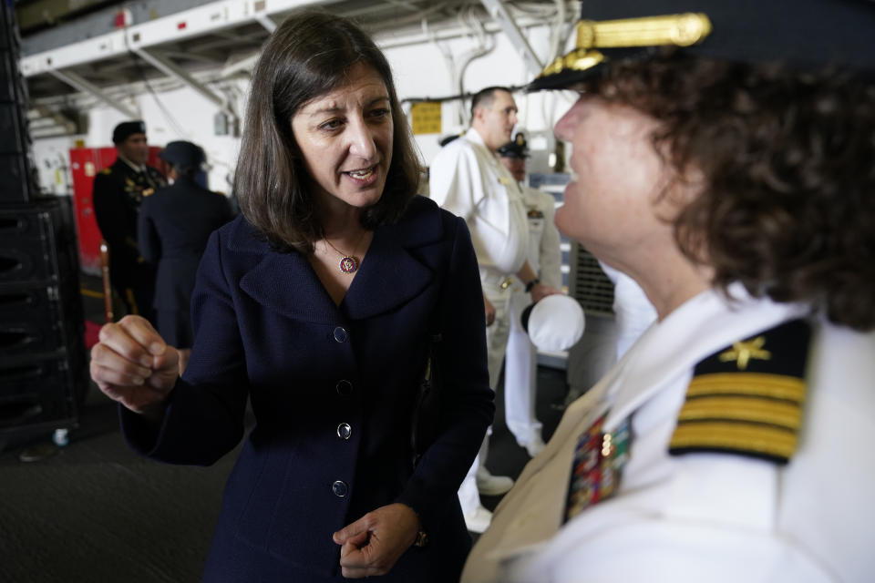 In this July 15, 2021, photo, Rep. Elaine Luria, D-Va., left, speaks to a Naval officer after a ceremony marking full operation of the NATO's Joint force Command aboard the USS Kearsarge at Naval Station Norfolk, in Norfolk, Va. Republicans and Democrats have something in common when it comes to recruiting candidates they hope will deliver majorities in Congress after the 2022 election, and that's military veterans.(AP Photo/Steve Helber)