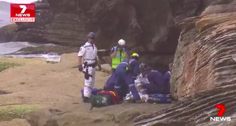 Emergency teams rush to the girl’s aid after she fell eight metres from a cliff. Source: 7News