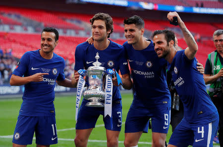 Soccer Football - FA Cup Final - Chelsea vs Manchester United - Wembley Stadium, London, Britain - May 19, 2018 Chelsea's Pedro, Marcos Alonso, Alvaro Morata and Cesc Fabregas celebrate winning the final with the trophy Action Images via Reuters/Andrew Couldridge