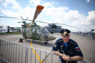 <p>A pilot seen by a Kamov Ka-226 small multi-purpose helicopter on display at the MAKS-2017 International Aviation and Space Salon in Zhukovsky, Moscow Region, Russia, July 18, 2017. (Photo: Sergei Bobylev/TASS via Getty Images) </p>