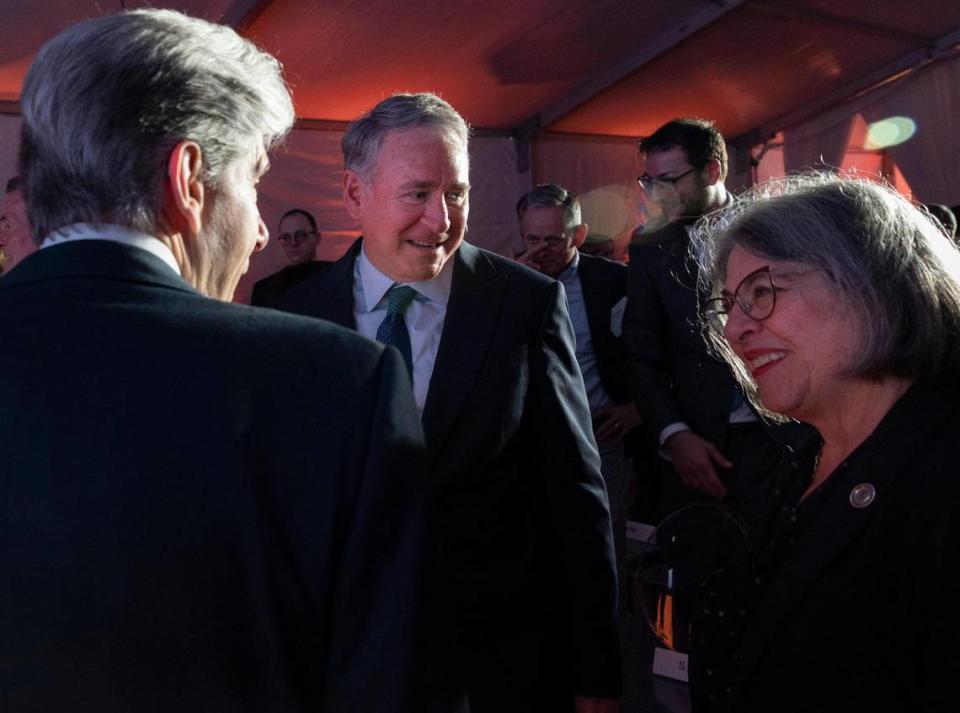 Ken Griffin, Citadel CEO, center, talks with Dr. Julio Frenk, president of UM, and Miami-Dade Mayor Daniella Levine Cava after a ceremony celebrating Griffin giving $50 million to Sylvester Comprehensive Cancer Center, Tuesday, March 5, 2024, at University of Miami Miller School of Medicine in Miami. Sylvester will name a new building after him, the Kenneth C. Griffin Cancer Research Building.