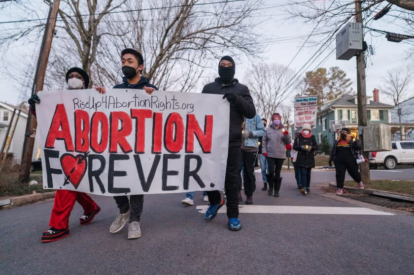 CHEVY CHASE, MD - JANUARY 22: Activists arrive to demonstrate outside the home of Justice Brett Kavanaugh in Chevy Chase, MD on January 22, 2022. (Photo by Craig Hudson for The Washington Post via Getty Images)