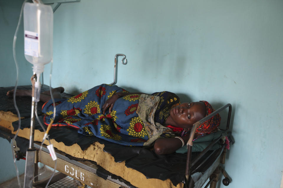 FILE - In this Monday, Sept. 6, 2010 file photo, a Nigerian woman suffering from cholera receives treatment at a village health clinic in Ganjuwa in Nigeria's northern Bauchi State. Nigeria is seeing one of its worst cholera outbreaks in years, with more than 2,300 people dying from suspected cases as the West African nation struggles to deal with multiple disease outbreaks. The 2021 outbreak which is associated with a higher case fatality rate than the previous four years is also worsened by what many consider to be a bigger priority for state governments: the COVID-19 pandemic. (AP Photo/Sunday Alamba, File)