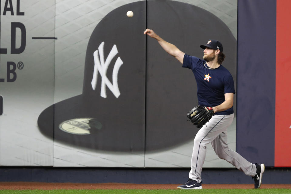 FILE - In this Monday, Oct. 14, 2019, file photo, Houston Astros Game 3 starting pitcher Gerrit Cole throws on the field at Yankee Stadium in New York, after the team arrived to prepare for the American League Championship Series, against the New York Yankees. Cole and the New York Yankees have agreed to a record $324 million, nine-year deal, a person familiar with the contract told The Associated Press, late Tuesday, Dec. 10, 2019. (AP Photo/Kathy Willens, File)