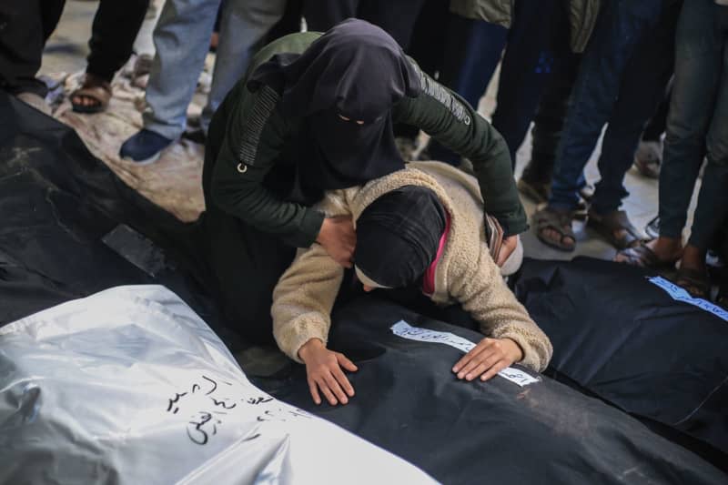 Palestinians mourn their relatives who were killed in an Israeli bombing on the city of Rafah in the southern Gaza Strip. Israel is planning a ground offensive on Rafah, into which hundreds of thousands of civilians have fled Israeli bombardment. Mohammed Talatene/dpa