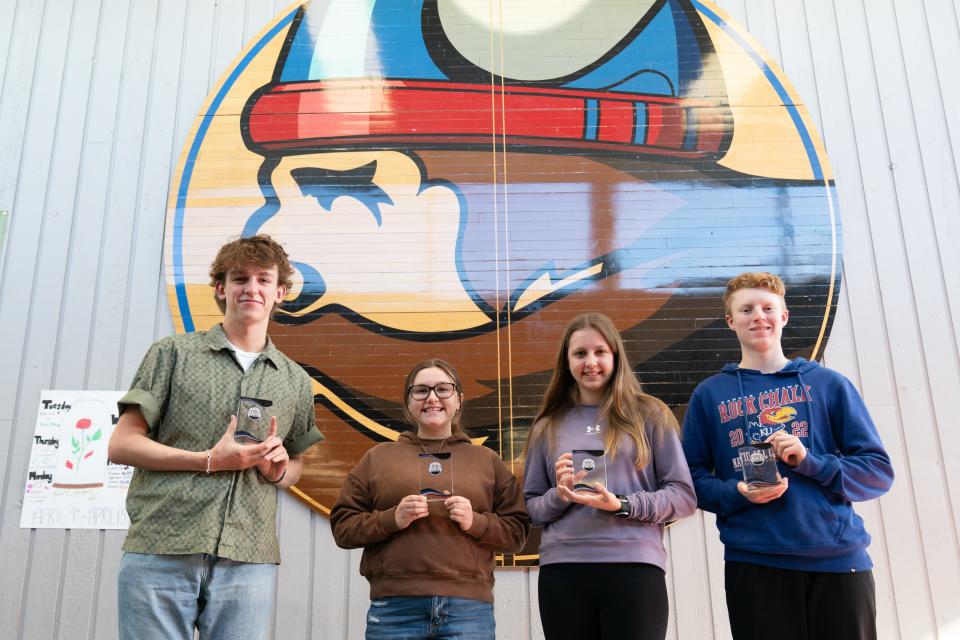 Seaman juniors, from left, Jeremiah Moylan, Sidney Chinn, Kylie Weir and Reece Mumford on Friday show off their first-place trophies from the Kansas Civics Games.