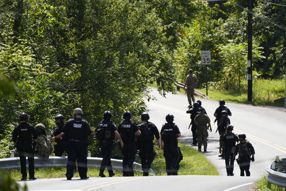 Law enforcement officers gather as the search for escaped convict Danelo Cavalcante continues Tuesday, Sept. 12, 2023, in Pottstown, Pa. (AP Photo/Matt Rourke)