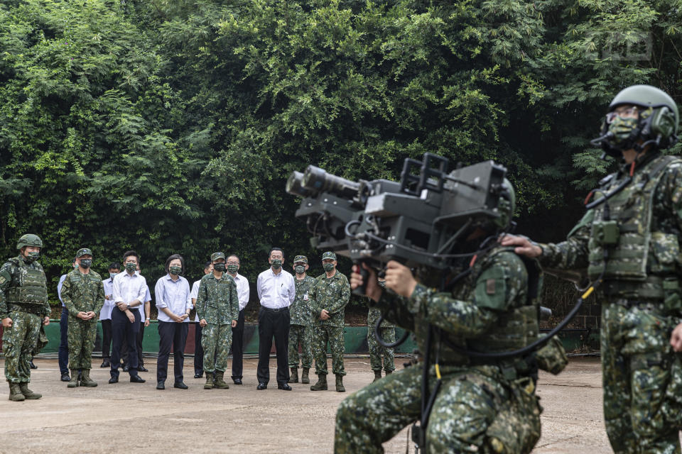 In this photo released by the Taiwan Ministry of National Defense, Taiwan's President Tsai Ing-wen watches soldiers operate equipment during a visit to a naval station on Penghu, an archipelago of several dozen islands off Taiwan's western coast on Tuesday, Aug. 30, 2022. Tsai told the self-ruled island's military units Tuesday to keep their cool in the face of daily warplane flights and warship maneuvers by rival China, saying that Taiwan will not allow Beijing to provoke a conflict. visit to the She also inspected a radar squadron, an air defense company, and a navy fleet. (Taiwan Ministry of National Defense via AP)