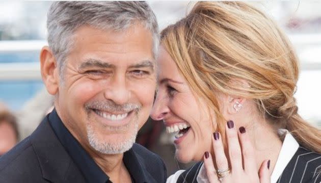 George Clooney and Julia Roberts, pictured in 2016, required dozens and dozens of takes to nail a kissing scene in their new movie 