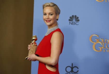 Jennifer Lawrence poses backstage with the award for Best Performance by an Actress in a Motion Picture - Musical or Comedy for her role in "Joy" at the 73rd Golden Globe Awards in Beverly Hills, California January 10, 2016. REUTERS/Lucy Nicholson