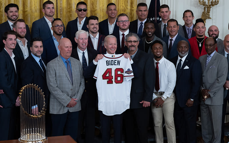 President Biden poses for photos with the Atlanta Braves