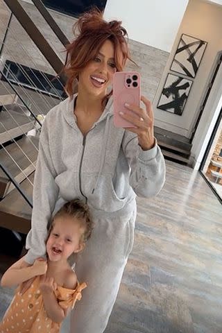 <p>brittany mahomes/instagram</p> Brittany Mahomes poses for a selfie with one of her kids