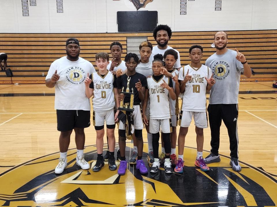 The Team DeVoe seventh grade team takes a photo with former Clemson and Shelby High standout Gabe DeVoe (back row), for whom the travel team is named following June's Team DeVoe Invitational.