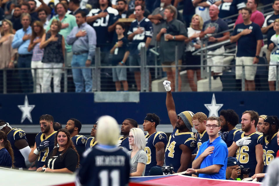 <p>Robert Quinn #94 of the Los Angeles Rams raises his fist during the National Anthem before the game against the Dallas Cowboys at AT&T Stadium on October 1, 2017 in Arlington, Texas. (Photo by Tom Pennington/Getty Images) </p>