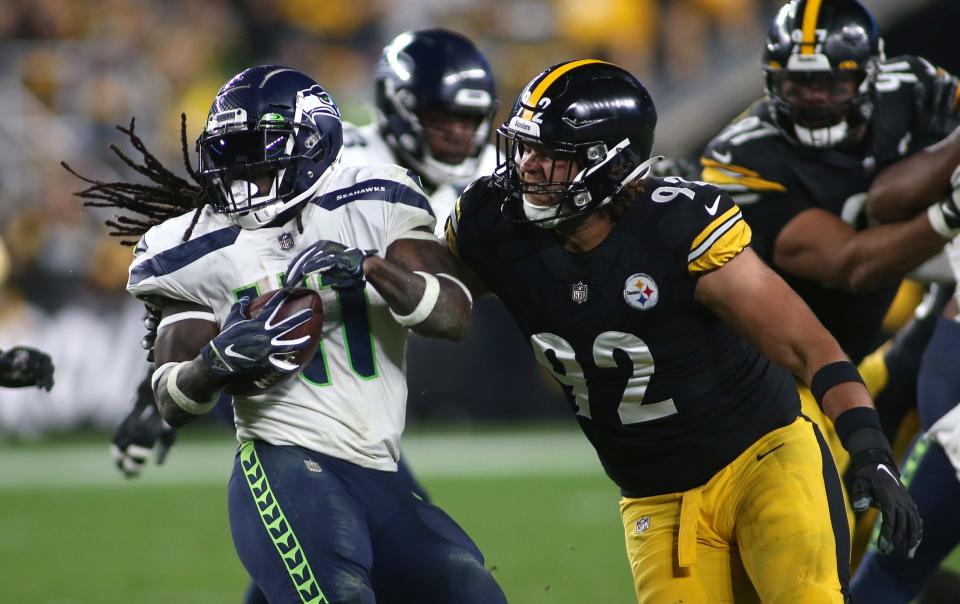 Seattle Seahawks wide receiver Cody Thompson (11) attempts to spin away from Pittsburgh Steelers defensive end Isaiahh Loudermilk in 2021.