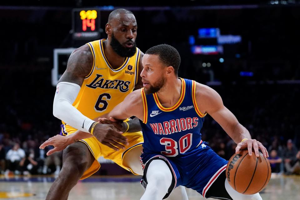 LeBron James defends against Stephen Curry during the second half of a game in Los Angeles in 2022.