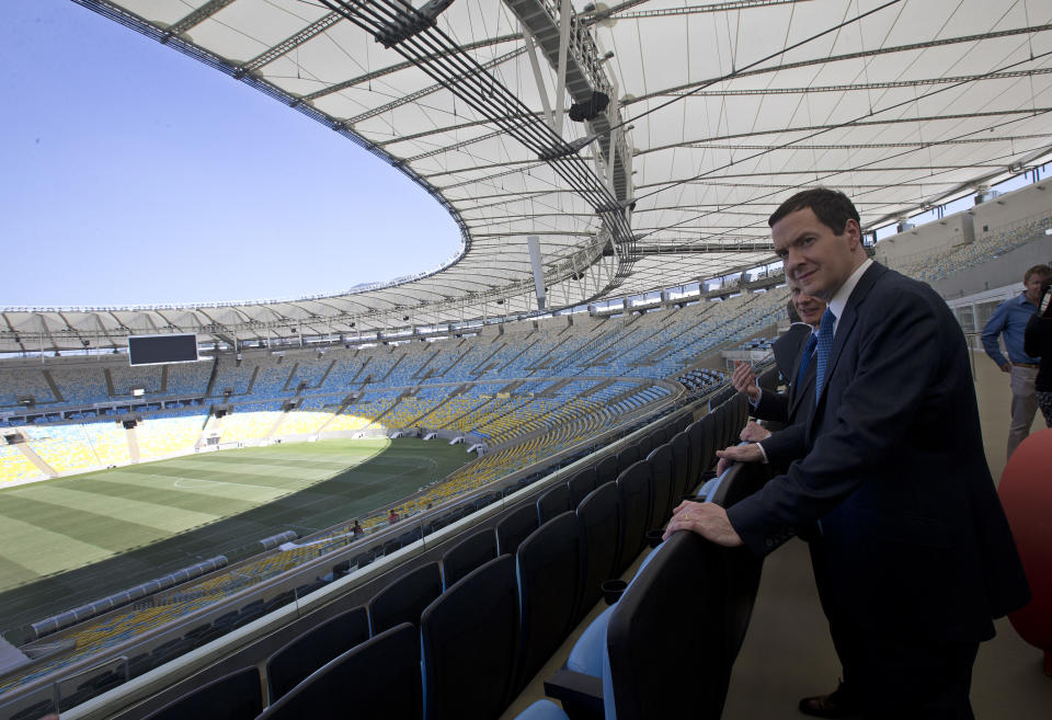 Britain's Chancellor of the Exchequer George Osborne visits the Maracana stadium in Rio de Janeiro, Brazil, Monday, April 7, 2014. The city of Rio de Janeiro will host the Olympics in 2016. (AP Photo/Silvia Izquierdo)